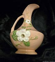 Front view showing floral relief, color, overall form