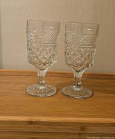 Two Wexford pattern water goblets side by side