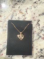 Pendant and chain displayed on foam pad