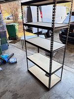 Full view of 5-shelf metal rack in garage