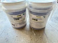 Two sealed Karcher cleaner pails wrapped together