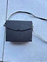 Closed black case front view