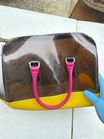 Front view of Furla PVC satchel showing colour blocks and handles