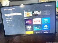 Front view powered on showing Roku home screen