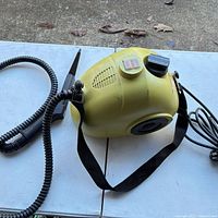 Full view of Steam Buggy unit with hose and nozzle attached