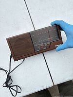 Front of Panasonic RE-6266 showing speaker, dial, push buttons, power cord