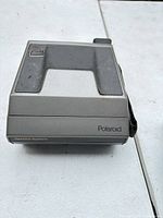 Front view showing Polaroid branding and Spectra System label