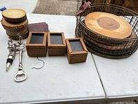 Group shot of wooden coasters, wire-rim trays, bar accessories