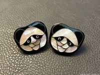front view of panda face earrings showing inlaid mother-of-pearl design