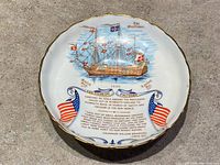 Top view showing Mayflower illustration, text and flags inside bowl