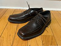 Pair of brown Florsheim square-toe lace-up shoes viewed from side and top