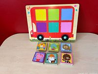 front of puzzle board and six tiles laid out