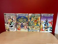 All four comic issues displayed front covers
