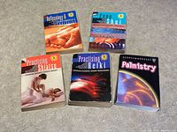 All five paperback books arranged on surface: Reflexology & Complementary Therapies, Feng Shui, Practising Shiatsu, Practising Reiki, Palmistry