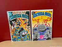 Front covers of Omega Men #1 and #2 bagged and boarded