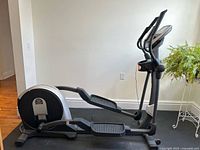 Full side view of Pro-Form 510 EX elliptical trainer showing frame, pedals, flywheel housing and console mast