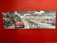 Front view of entire Route 66 canvas print on red wall