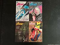 All four comic issues laid out showing front covers