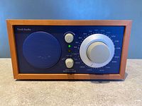 Front view showing speaker, knobs, and tuning dial