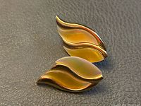 front view of both earrings showing flame design and enamel