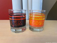 Front view of both labeled glasses showing graphics