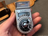 Front view of Sekonic Type L-VI light meter held in hand