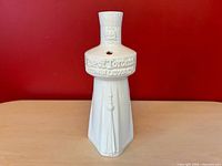 Full front view of white glazed ceramic CN Tower souvenir cup