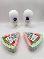 Two Nivea deodorant sticks and two Beloved bath bombs