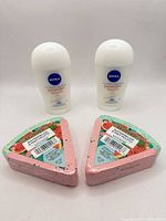 Group shot of both Nivea antiperspirants and both Beloved bath bombs