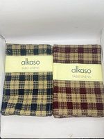 Two Alkaso placemat sets in original bands