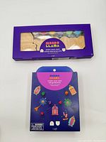 Two boxed Mondo Llama craft kits: Eid garland kit and wood characters kit
