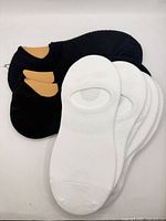 Group view of all black and white no-show socks