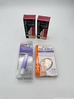 All four packaged nail care items grouped