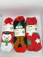 Front view of three packaged sets showing George branding, 5 pairs label, and holiday designs