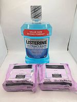 Listerine Ultraclean mouthwash with two Equate facial wipes packs