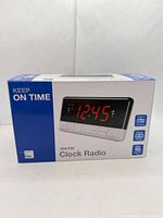 Front of closed retail box showing product image and time 12:45