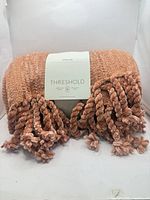 Folded Threshold throw blanket showing texture and fringe