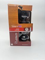 Front of sealed ToughGuard entry knob box showing black knobs through window