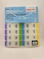 Front view of sealed Walgreens 28-compartment pill organizer