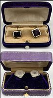 Both open boxes showing two different cufflink pairs