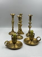 Six brass candlesticks three pairs assorted styles
