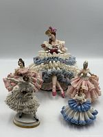 Group shot of all five porcelain lace figurines