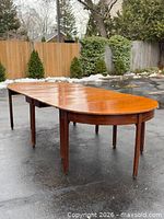 Two tables joined forming long dining table, view from side