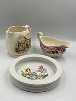Front view of pitcher, gravy boat, bowl