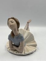 Front side of Lladró Heather figurine reclined, showing face, bodice, tutu