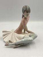 Front angled view of Lladro Shelley figurine showing pose and colors