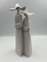 Front view of Lladro figurine showing two nuns standing together