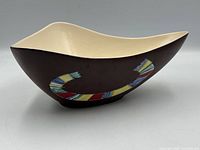 Side profile showing brown exterior and mosaic design