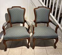 Front view of both Louis XV style armchairs
