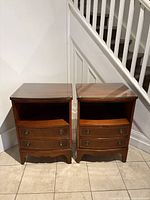 Front view of both mahogany nightstands side by side showing overall design and condition